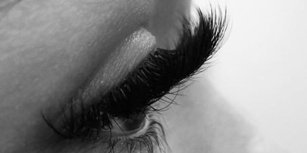 Black and White image of woman's eye and eyelash